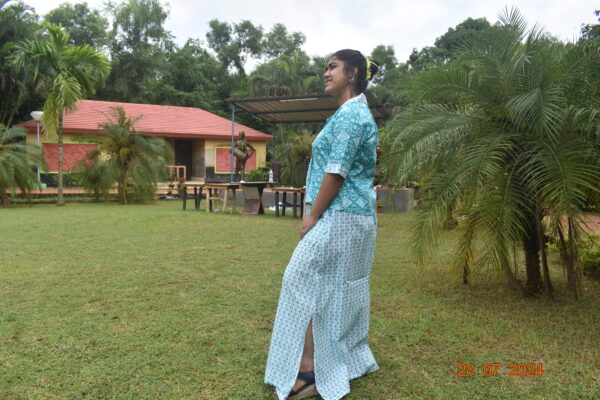 “White and sky blue skirt set with a side slit and pockets, paired with a matching top. Perfect blend of style and comfort.” BY SMITA SINHA